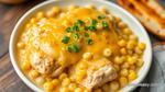 Bake Chicken Thighs in Cheesy Hominy Delight