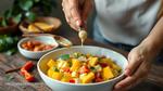 Mixing Mango Salad with Lime Dressing